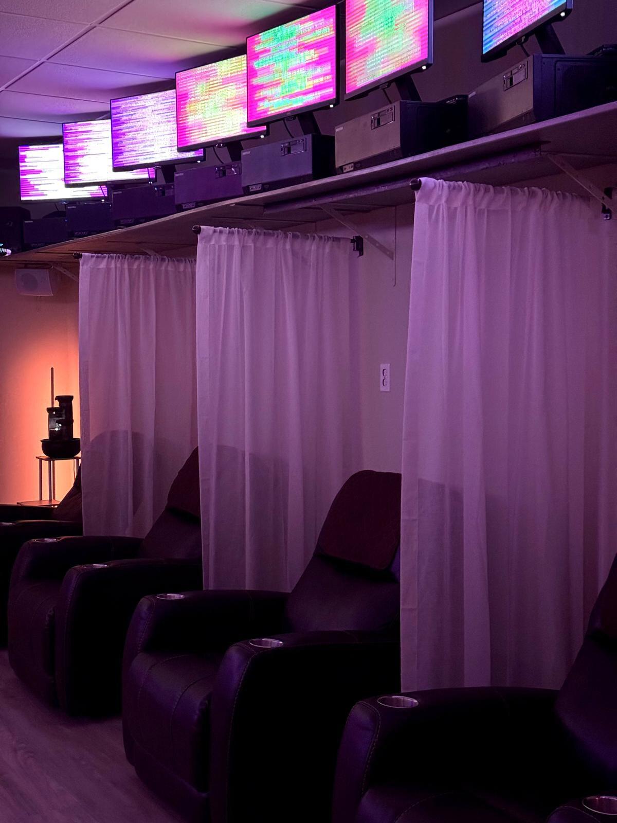Inside the Regeneration Room — our EESystem™ energy room with private curtained recliner booths